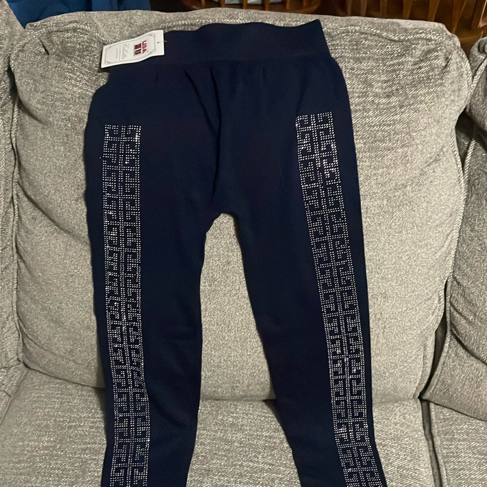 Navy leggings with silver stud designs on the front